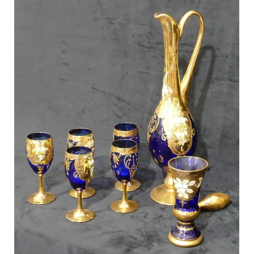 126 - A Viennese blue and gilt glass round bulbous tall jug with stopper, 5 matching glasses with raised f... 