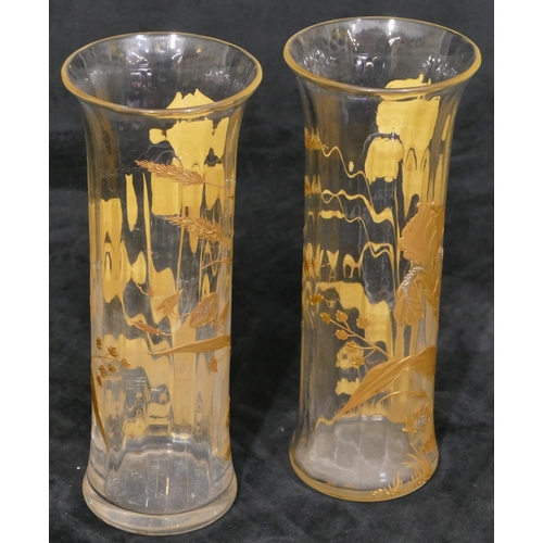 17 - A pair of clear cylindrical trumpet shaped spill vases with raised gilt floral and leaf decoration, ... 