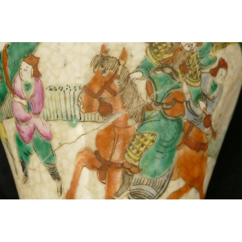 29 - An Oriental round bulbous thin necked trumpet shaped crackleware vase with multi-coloured warrior de... 