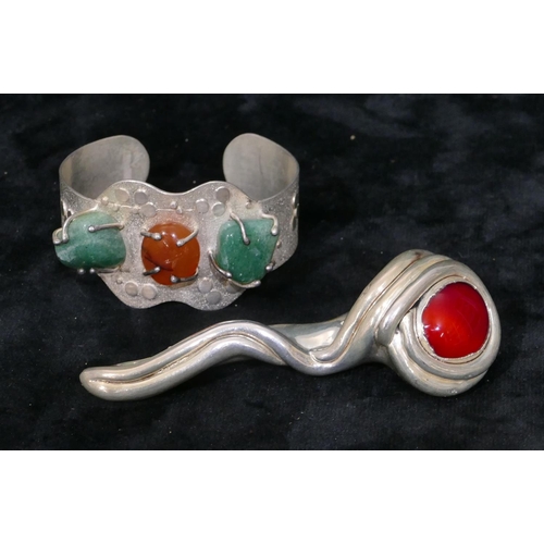 397 - A Continental silver filled brooch with red stone motif, 10.2cm high, a modern London silver bangle ... 