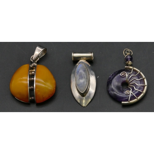 404 - A silver and amber drop pendant and 2 other drop pendants (3)