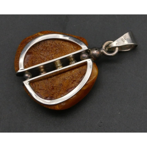 404 - A silver and amber drop pendant and 2 other drop pendants (3)