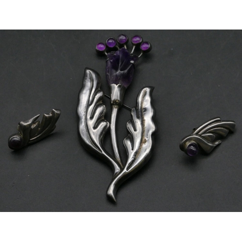 406 - A Mexican 925 silver and amethyst floral brooch, 10.5cm high, a pair of similar earrings (3)