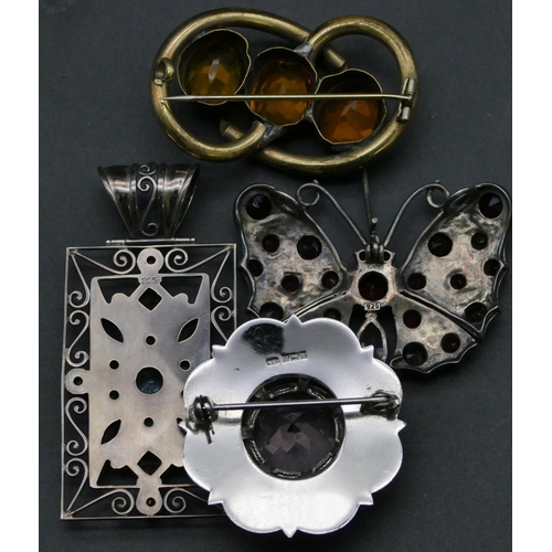 407 - A silver and garnet brooch in the form of a butterfly and 3 other brooches (4)