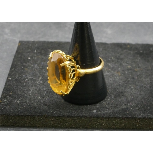 410 - A ladies gold oval citrine ring, Size Q, 8.4 grams gross