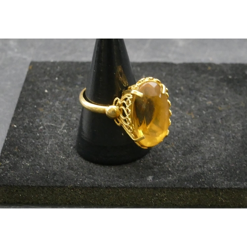 410 - A ladies gold oval citrine ring, Size Q, 8.4 grams gross