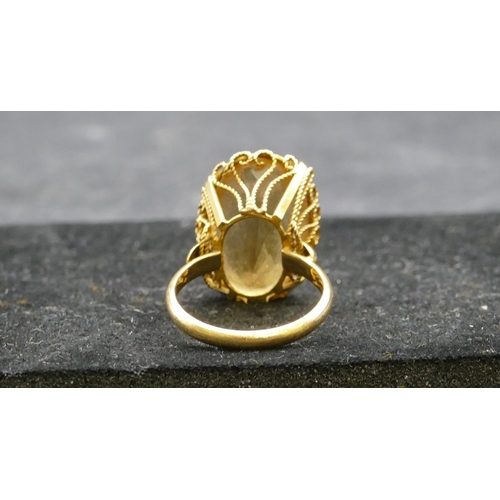 410 - A ladies gold oval citrine ring, Size Q, 8.4 grams gross