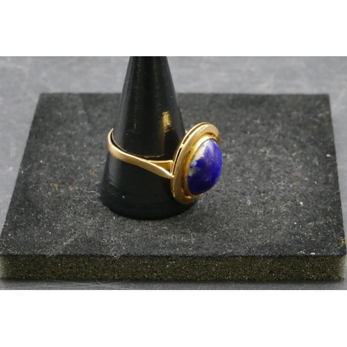 412 - An Eastern high carat gold oval ladies ring set with centre blue stone, Size U/V, 6.2 grams gross