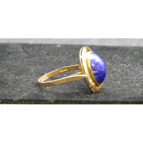 412 - An Eastern high carat gold oval ladies ring set with centre blue stone, Size U/V, 6.2 grams gross