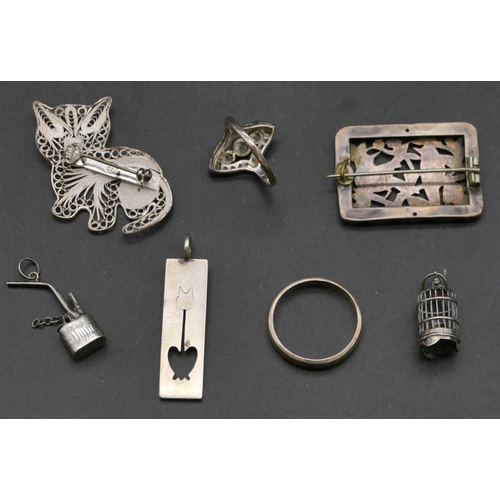 419 - A 925 silver Art Deco style dress ring, a silver wedding ring, 3 charms and 2 brooches (7)