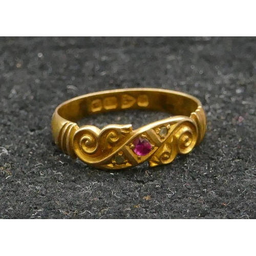 455 - An 18ct gold ring set with centre ruby and flanked by rough cut diamonds, size L/M, 2.4 grams gross.