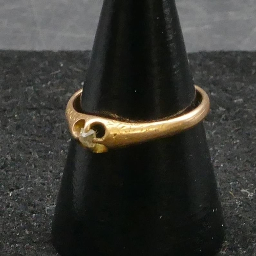 456 - A gold small solitaire diamond ring, size N, 2 grams gross.