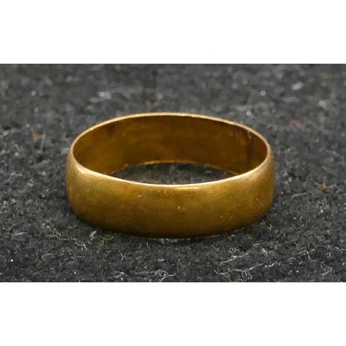 457 - A 22ct gold wedding ring, size K, 2.7 grams gross.