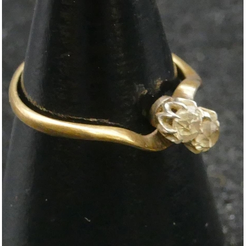 459 - An 18ct gold ladies twist diamond ring set with 2 diamonds, approx. 0.20ct each, size L/M, 2.1 grams... 