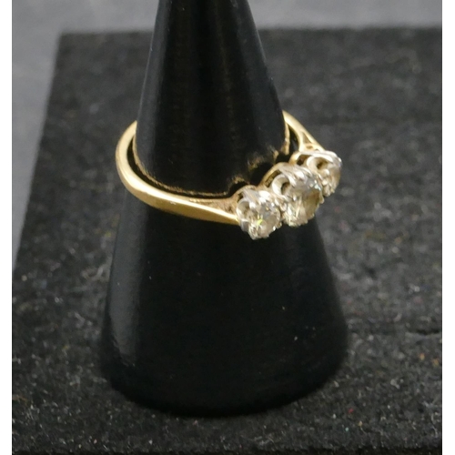 464 - An 18ct gold ladies 3-stone diamond ring, centre diamond approx. 0.60ct, size K, 2.4 grams gross.