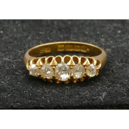 465 - An 18ct gold ladies 5-stone graduated diamond ring with pierced shoulders, centre diamond approx. 0.... 