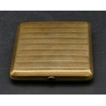 A 14ct gold cigarette case with red stone cabochon button, engraved key pattern and part engine turn... 