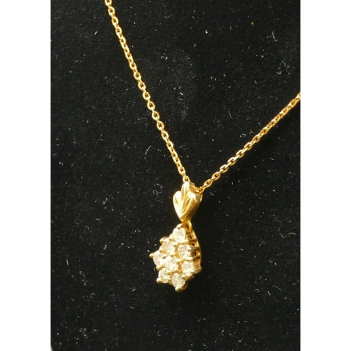 472 - A gold pendant mounted with white sapphires, with chain, 4.8 grams gross.