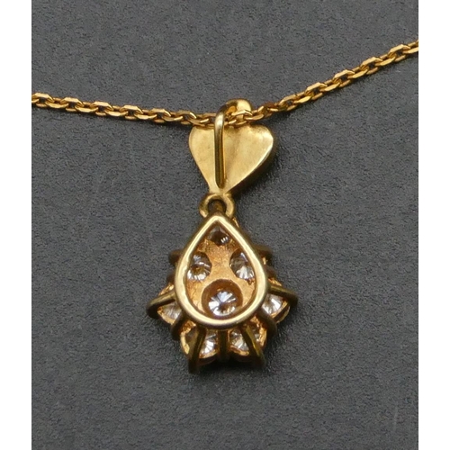 472 - A gold pendant mounted with white sapphires, with chain, 4.8 grams gross.