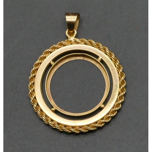 475 - An 18ct gold sovereign holder pendant (no sovereign) with rope rim, 3.6cm diameter, 6.6oz.