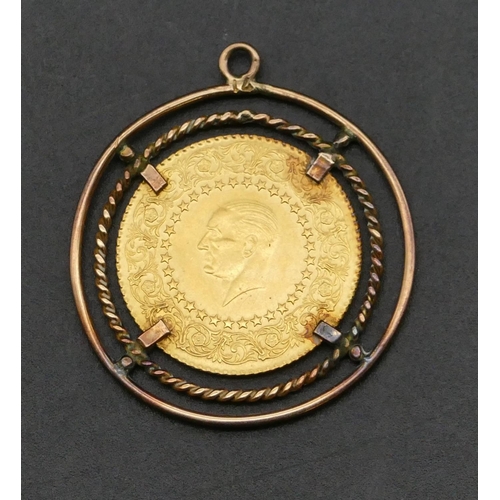 485 - An Eastern gold coin mounted in 9ct gold circular pendant, 5.4 grams gross.