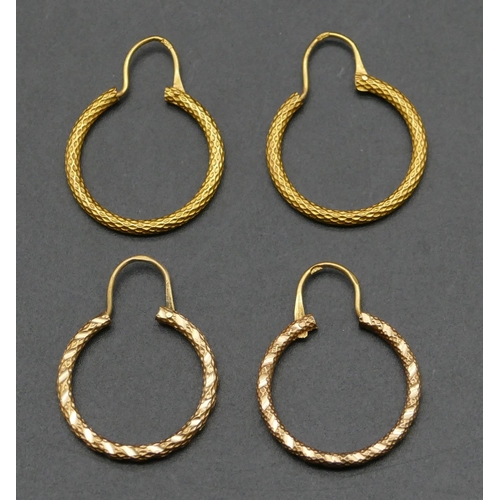 489 - 2 pairs of high carat gold Eastern hoop earrings, 2.5cm diameter, 6.4 grams.