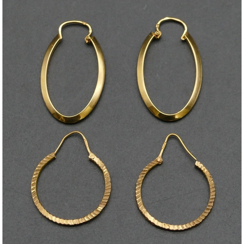 490 - A pair of oval high carat gold hoop earrings and a similar circular pair of high carat gold hoop ear... 