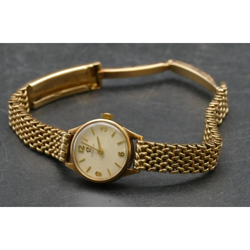 492 - A ladies Omega 9ct gold circular wristwatch with matching strap bracelet, weighable gold without mov... 