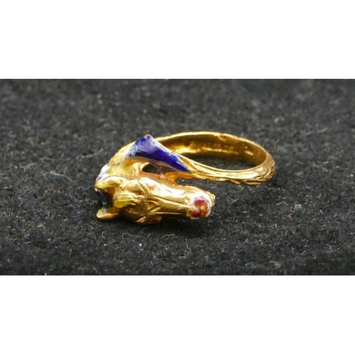 497 - An 18ct gold ring in form of a horse's head with allover enamelled decoration, size K, 5.6 grams gro... 