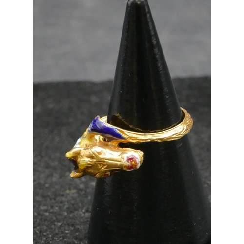 497 - An 18ct gold ring in form of a horse's head with allover enamelled decoration, size K, 5.6 grams gro... 