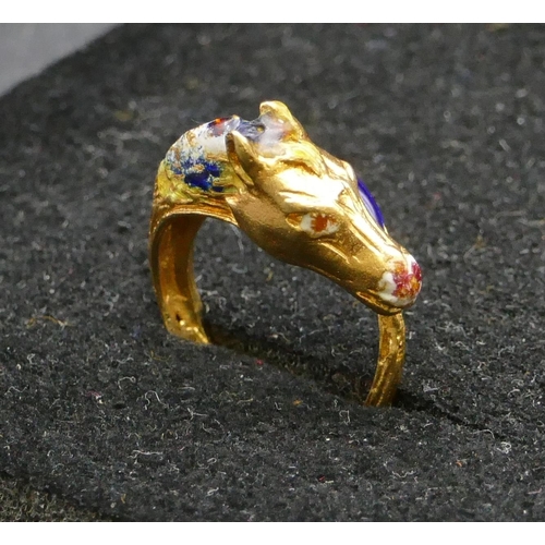 497 - An 18ct gold ring in form of a horse's head with allover enamelled decoration, size K, 5.6 grams gro... 