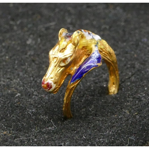 497 - An 18ct gold ring in form of a horse's head with allover enamelled decoration, size K, 5.6 grams gro... 