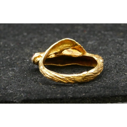 497 - An 18ct gold ring in form of a horse's head with allover enamelled decoration, size K, 5.6 grams gro... 