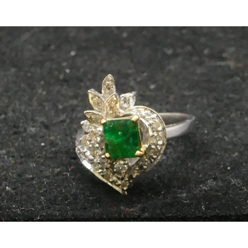 502 - A high carat white gold ladies cluster ring set with centre emerald and surrounded by diamonds, size... 