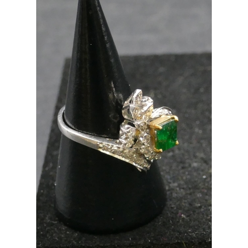 502 - A high carat white gold ladies cluster ring set with centre emerald and surrounded by diamonds, size... 