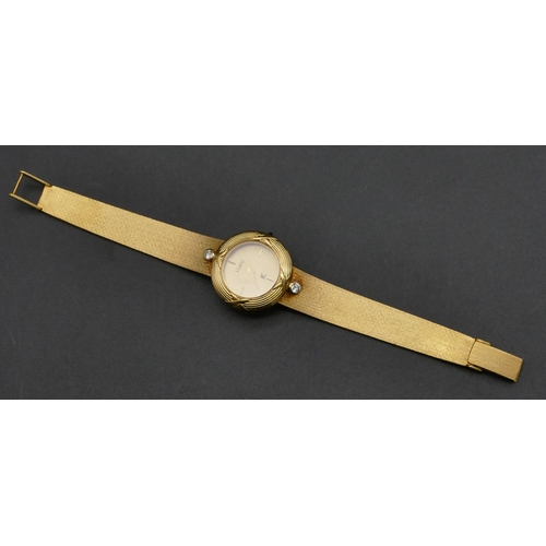 503 - An 18ct gold Khalid ladies circular wristwatch mounted with 2 diamonds, matching strap bracelet, 16.... 