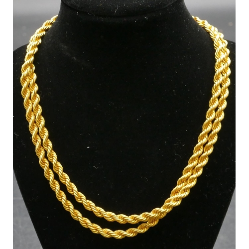 504 - An 18ct gold rope linked necklace, 67.5cm long, 25.1 grams.