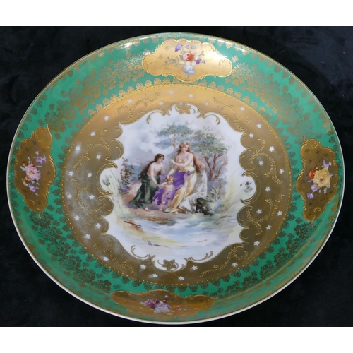 65 - A Continental china round charger on white and green ground with multi-coloured female cupid, floral... 