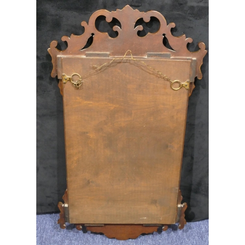 701 - A 20th Century burr walnut Chippendale style hanging wall mount with scroll and pierced decoration, ... 