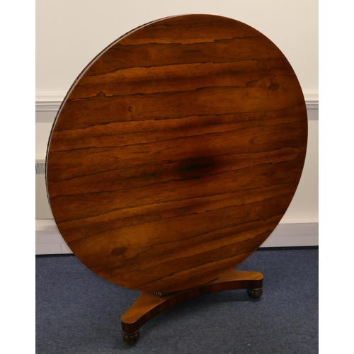 705 - A 19th Century rosewood round tilt top breakfast table on triangular stem with splayed base and flut... 