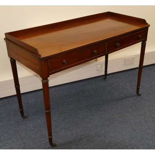 706 - A 19th Century mahogany side table with lipped back, 2 drawers with wood knob handles, round turned ... 