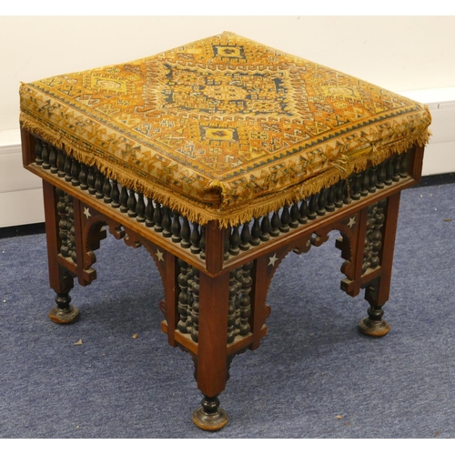 713 - An Eastern walnut square stool with overstuffed seat, turned finial frieze with part inlaid Mother o... 