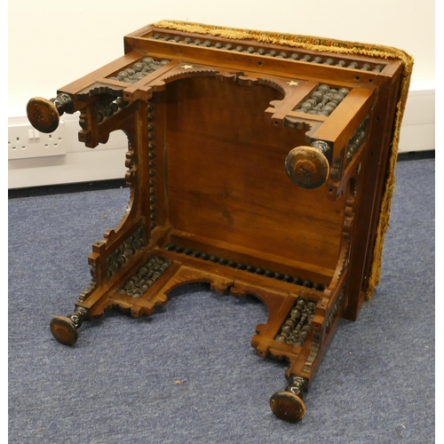 713 - An Eastern walnut square stool with overstuffed seat, turned finial frieze with part inlaid Mother o... 