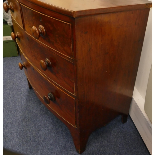 722 - A 19th Century mahogany small bow fronted chest of drawers with 2 short, 2 long graduated drawers wi... 