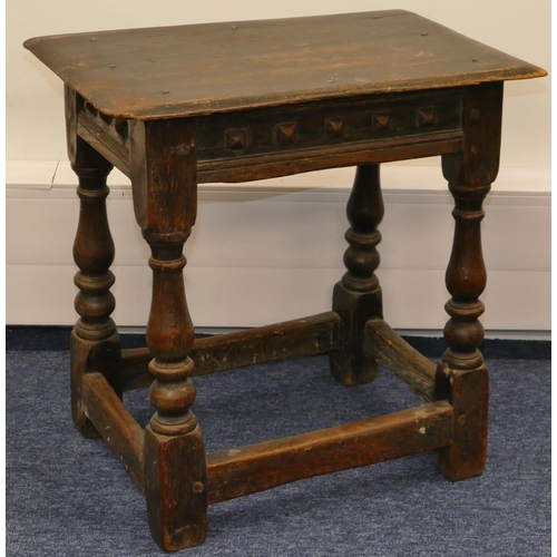 723 - An early oak joint stool with raised studded frieze, on round turned legs with stretchers, 45.5cm wi... 