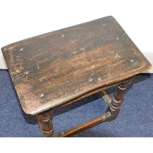 723 - An early oak joint stool with raised studded frieze, on round turned legs with stretchers, 45.5cm wi... 