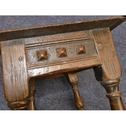 723 - An early oak joint stool with raised studded frieze, on round turned legs with stretchers, 45.5cm wi... 