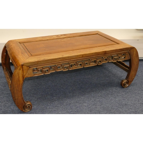 727 - A Chinese hardwood low rectangular shaped coffee table with pierced key pattern frieze, on scroll le... 