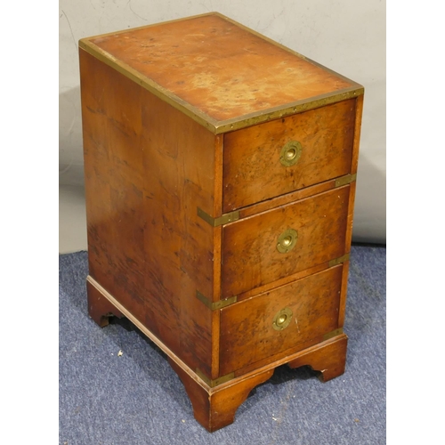 734 - A burr maple wood small chest with brass banding, 3 drawers with inset brass handles, on bracket fee... 