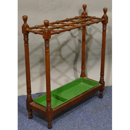 744 - A 19th Century mahogany rectangular shaped umbrella stand with 2 rows of 6 sections on round, turned... 